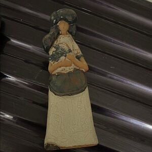 Artistic Figurine with Floral Accent